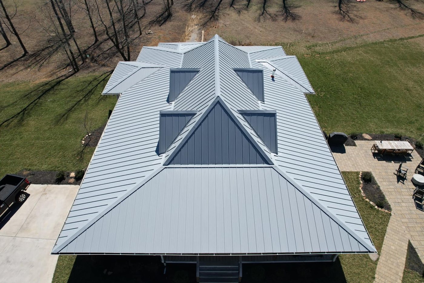Standing-seam metal roof installed by FLOW Roofing