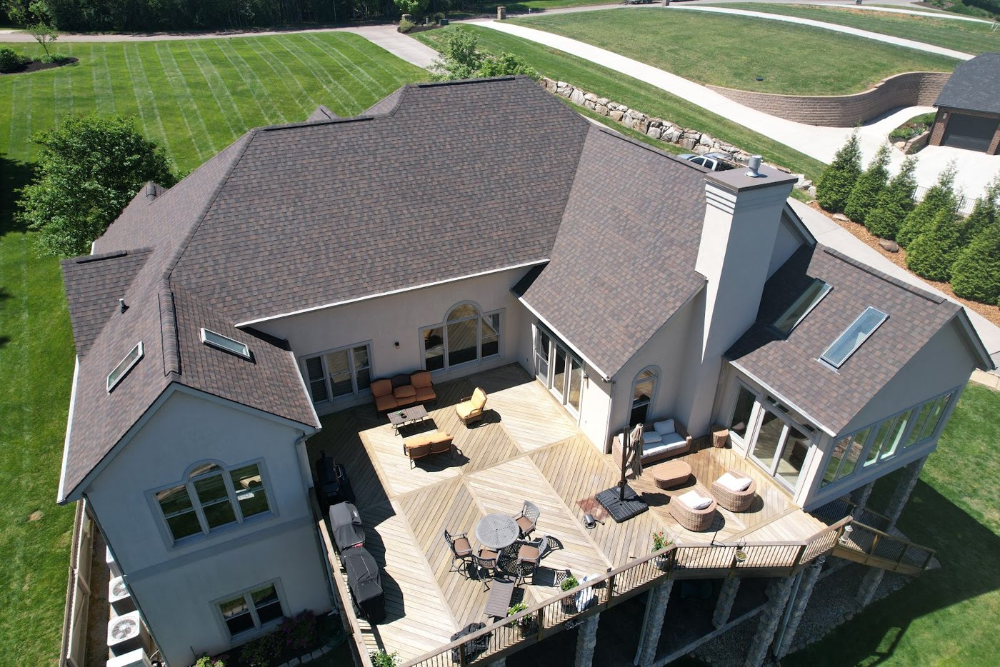 Freshly re-roofed home exterior with clean siding